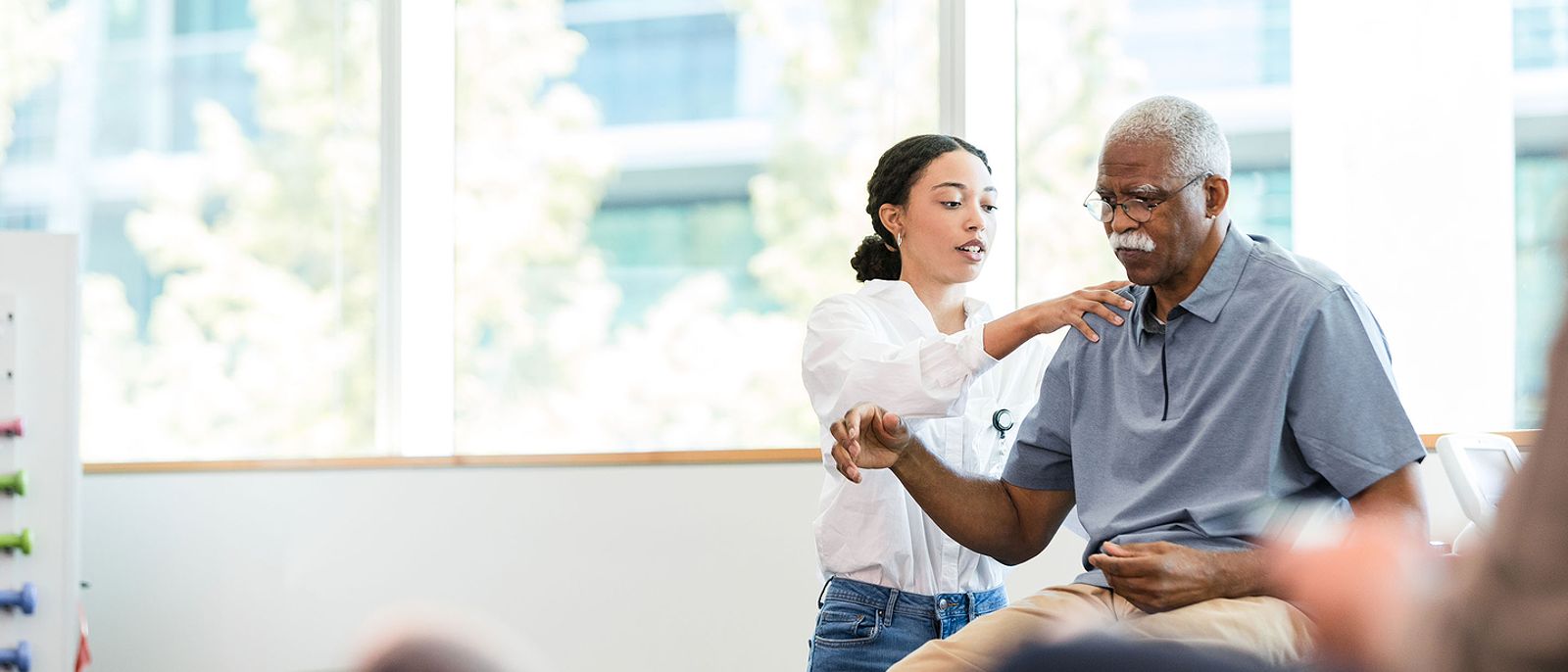 Patient receiving physical therapy treatment from physical therapist