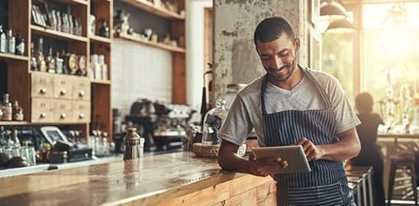 Smiling business owner at a counter