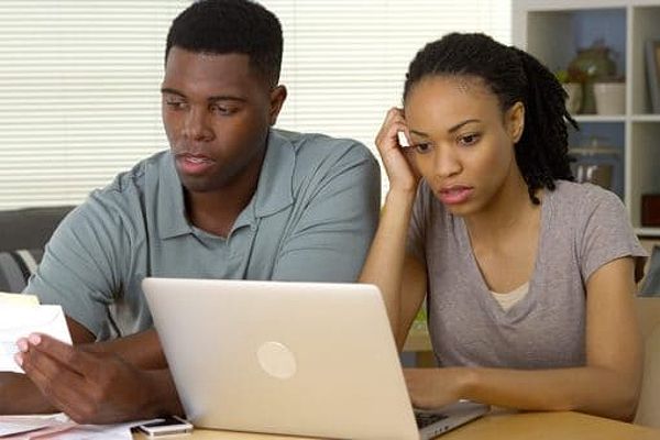 A young couple looks over documents