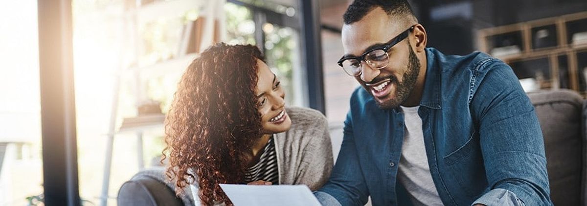 Young couple reviewing home equity loan vs HELOC